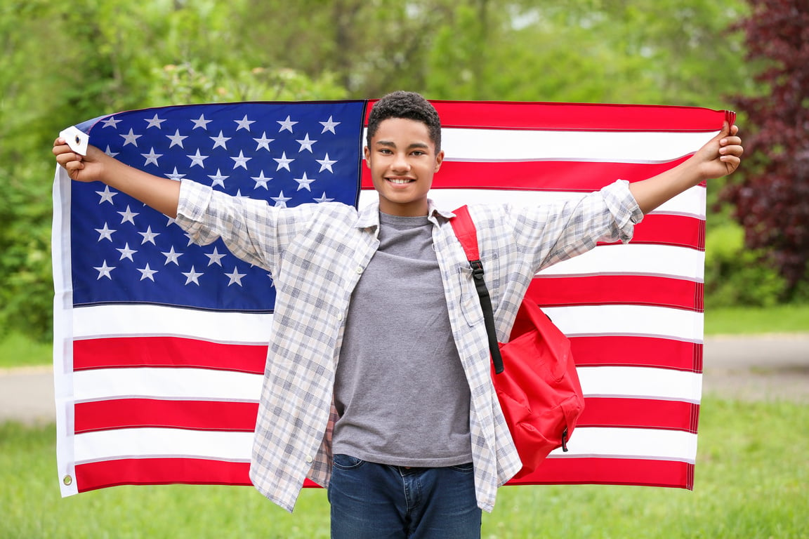 African-American Student with USA Flag Outdoors